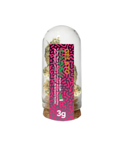 Glass container with a colorful label featuring text and patterns on a white background