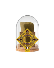 Hash product in a glass dome with a label on a white background